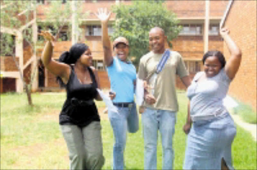 AT LAST: Thandokuhle Khumalo, Lerato Posholi, Nkululelo Mkhwanazi and Lindiwe Mbanjwa of the Reasoma Secondary School in Protea, Soweto , Celebrate after finding out they had obtained distinctions in their subjects. 30/12/2008. Pic. Bafana Mahlangu. © Sowetan.