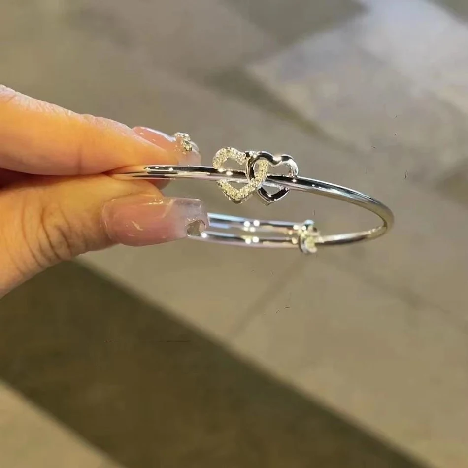 Bransoletka Doppel Herz Push-Pull Heart-to-Heart dla miłości. Połącz i rozłącz, symbolizując związek i emocjonalną bliskość.