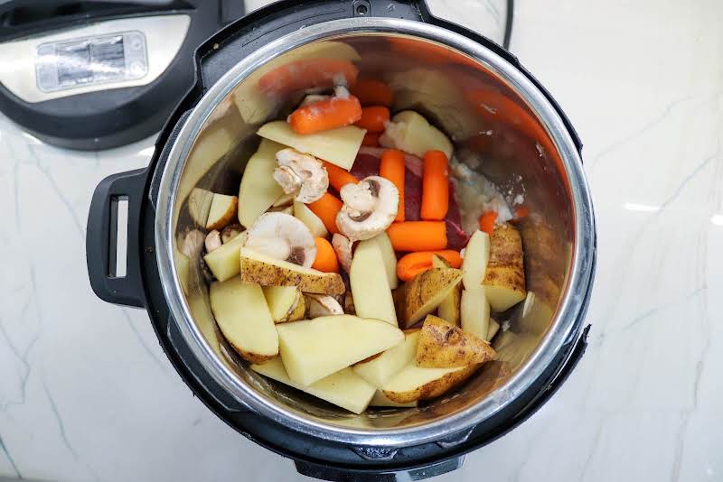 Ingredients Added To A Slow Cooker.