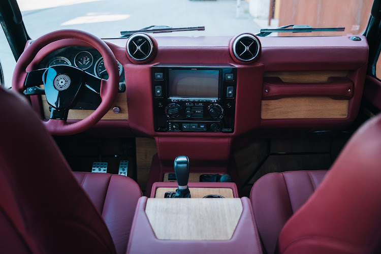 The interior of the Defender is transformed using wood, leather and carbon fibre bits. Picture: SUPPLIED