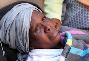 Tears run down Pinky Chili's cheeks after the roof of her home collapsed, killing her daughter Mpume Chili and her granddaughter Sbahle, 2, on June 15, 2018.
