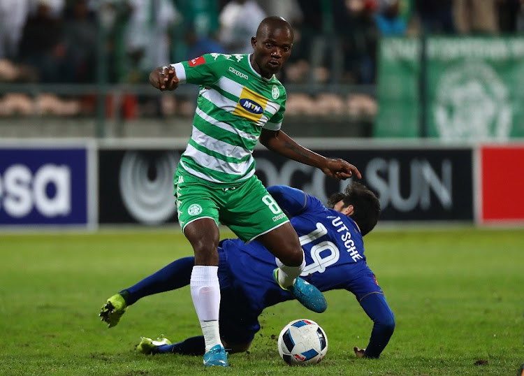 Lantshene Phalane of Bloemfontein Celtic evades challenge from Roland Putsche of Cape Town City during the Absa Premiership 2017/18 football match between Cape Town City FC and Bloemfontein Celtic at Athlone Stadium, Cape Town on 17 October 2017.