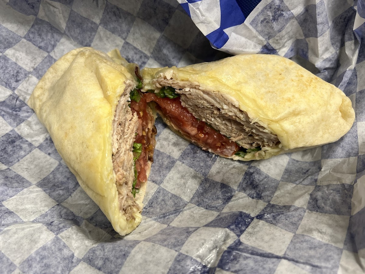 Turkey club on a GF wrap. The turkey seems to be real turkey, not sliced deli meat. Great flavor and substantial portion.