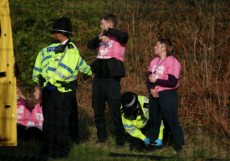 Animal rights activists are detained by police officers at Aintree Racecourse in Liverpool, Britain, on April 15 2023 Picture: PHIL NOBLE/REUTERS