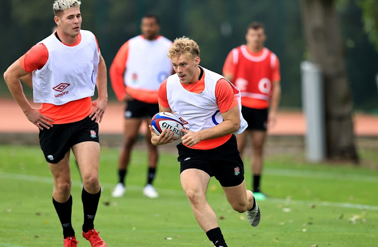 Louis Lynagh runs with the ball during the England training session held at The Lensbury on September 28, 2021 in Teddington, England.