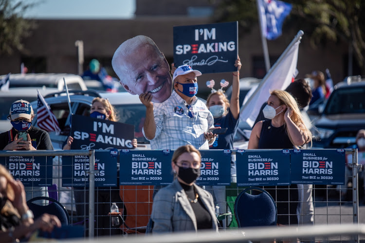 People wait for Senator Kamala Harris, Democratic vice-presidential nominee, on October 30 2020. Picture: BLOOMBERG/SERGIO FLORES