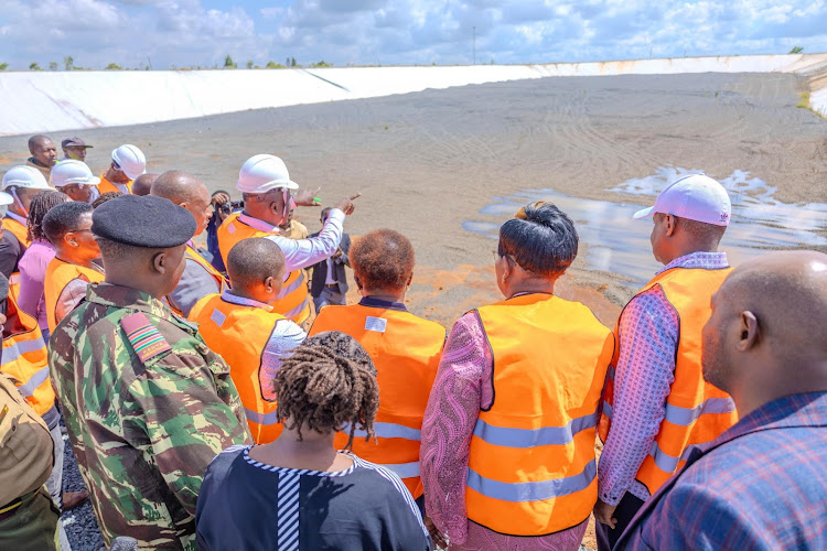 Government officials during an inspection tour of the Sh1.1bn sanitary landfill.