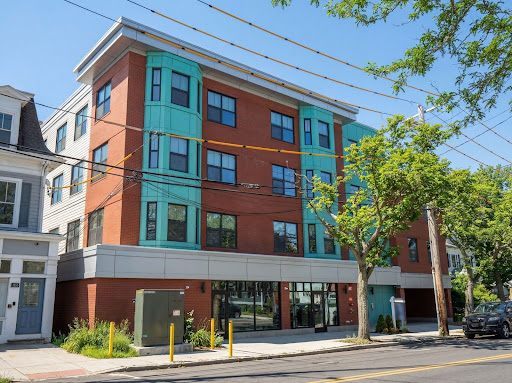 Prestige property for sale in Newton (United States) - Modern brick turquoise building facade