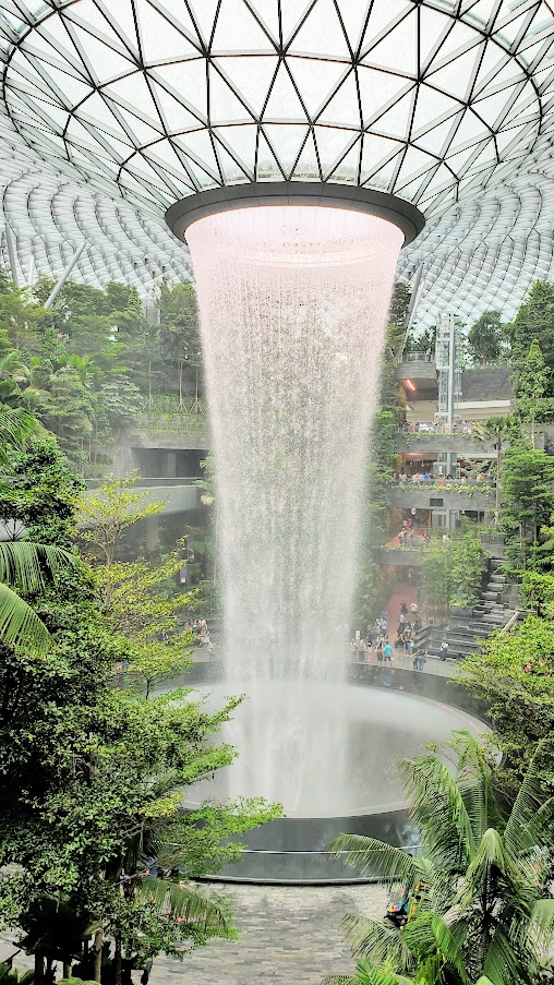 Visiting Changi Airport in Singapore: the famous HSBC Rain Vortex and the surrounding Shiseido Forest Valley - four stories of greenery surrounding the world's tallest indoor waterfall