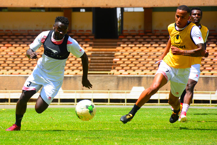 Harambee Stars' defender Musa Mohammed (L) wheels away from Ismael Gonzalez during a training session at Moi Stadium, Kasarani.