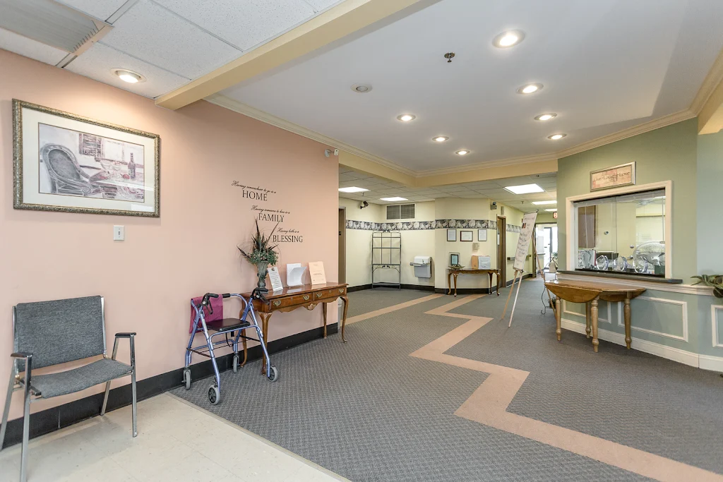 Entry to Olde Oak Tree apartments with seating and welcome desk