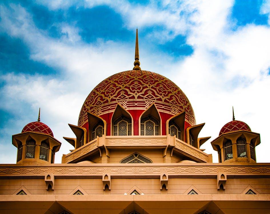 Free View of Temple Against Cloudy Sky Stock Photo