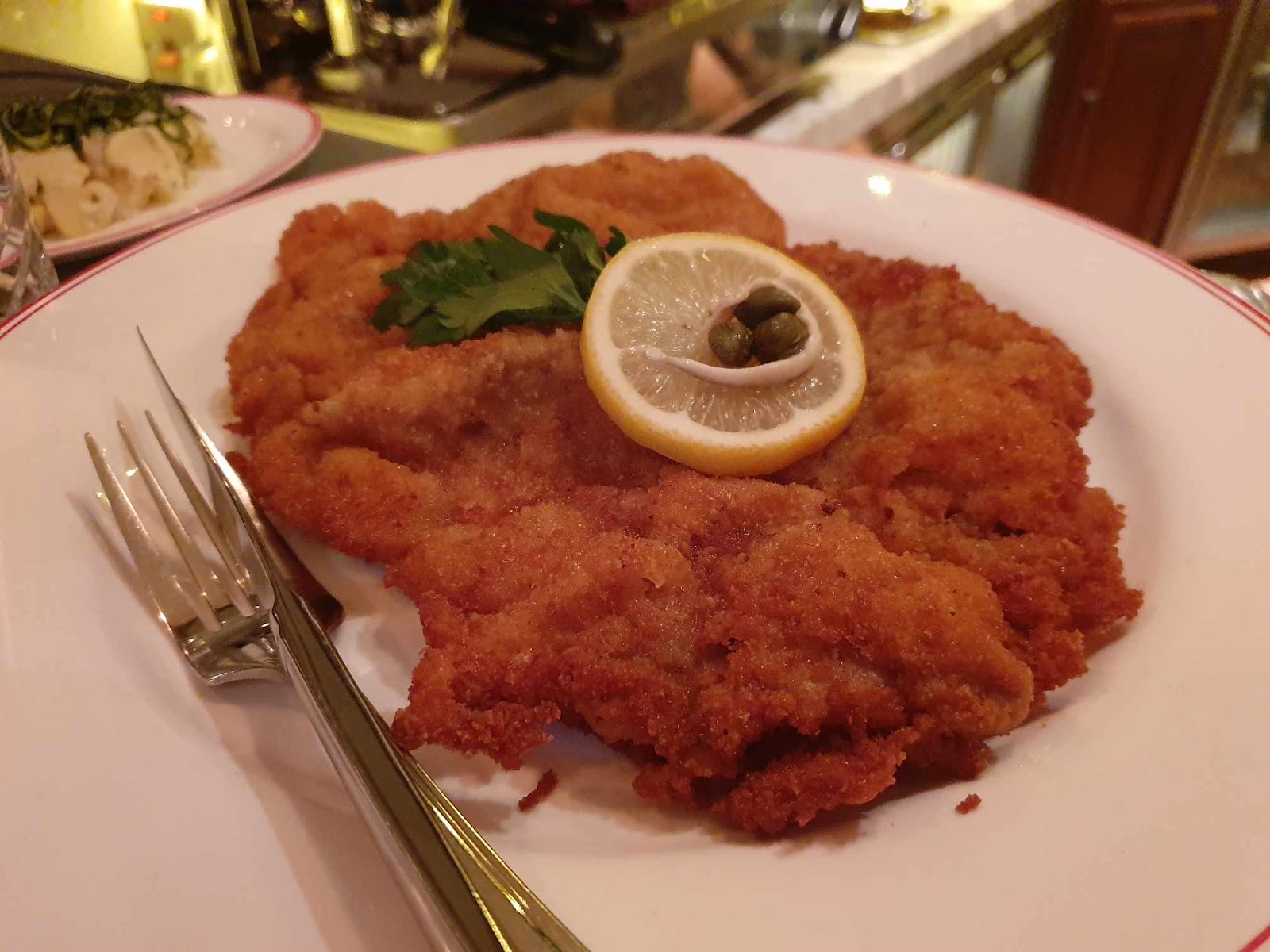 Schnitzel & Schnaps signature wiener schnitzel with lemon wedge