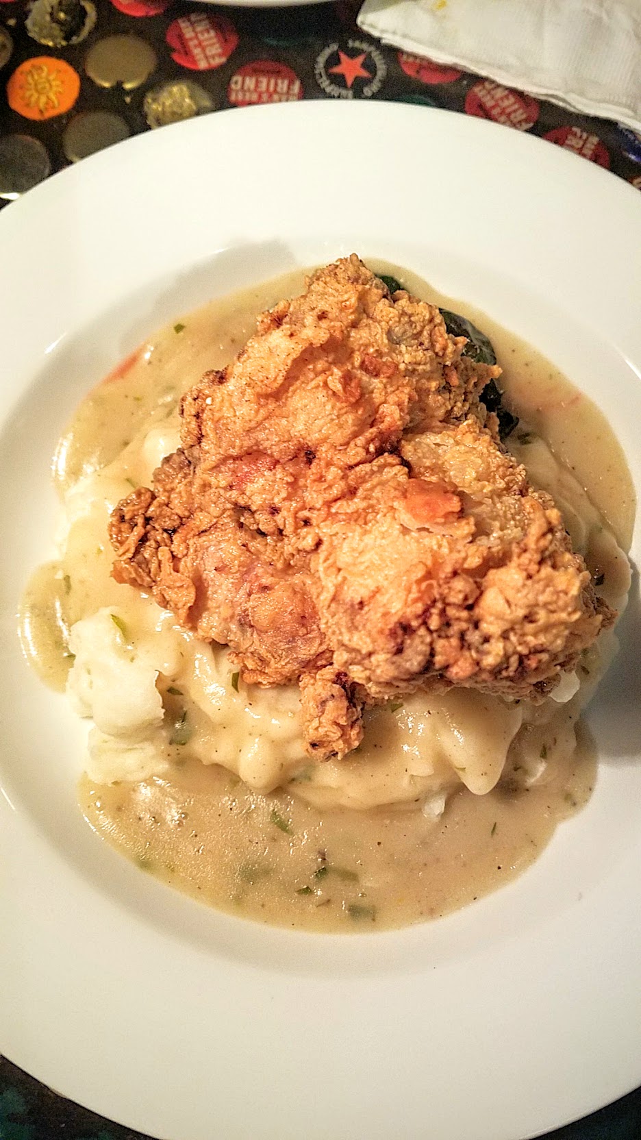 Example Food at Saraveza buttermilk fried chicken with mashed potatoes and braised chard and tarragon gravy