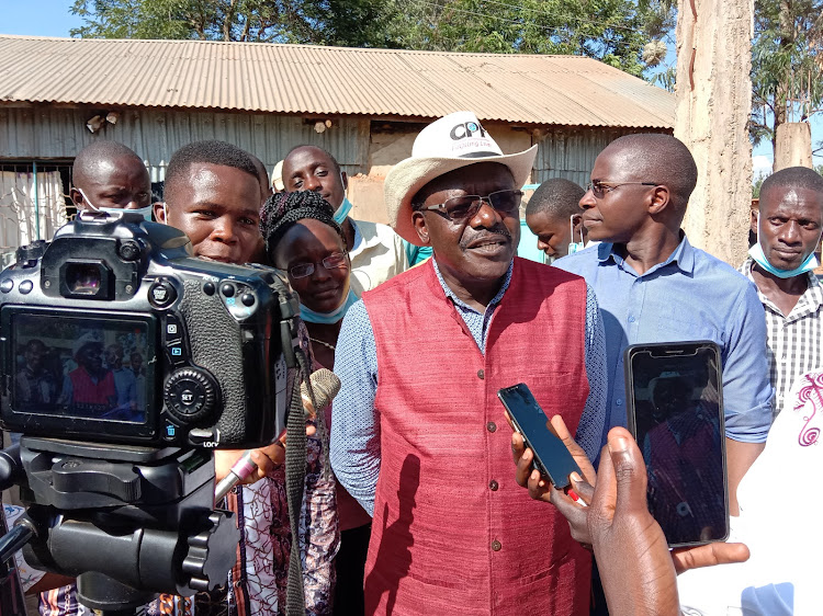 Mukhisa Kituyi speaks to the press in Kakamega