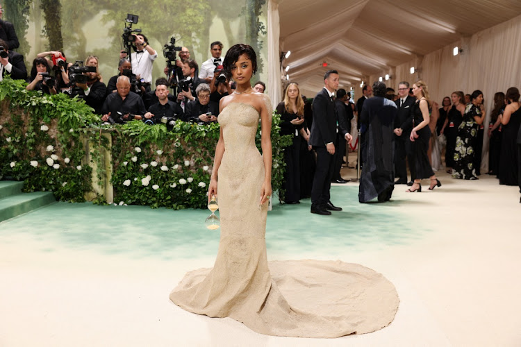 Tyla's in a cascading sand dress at the Met Gala.