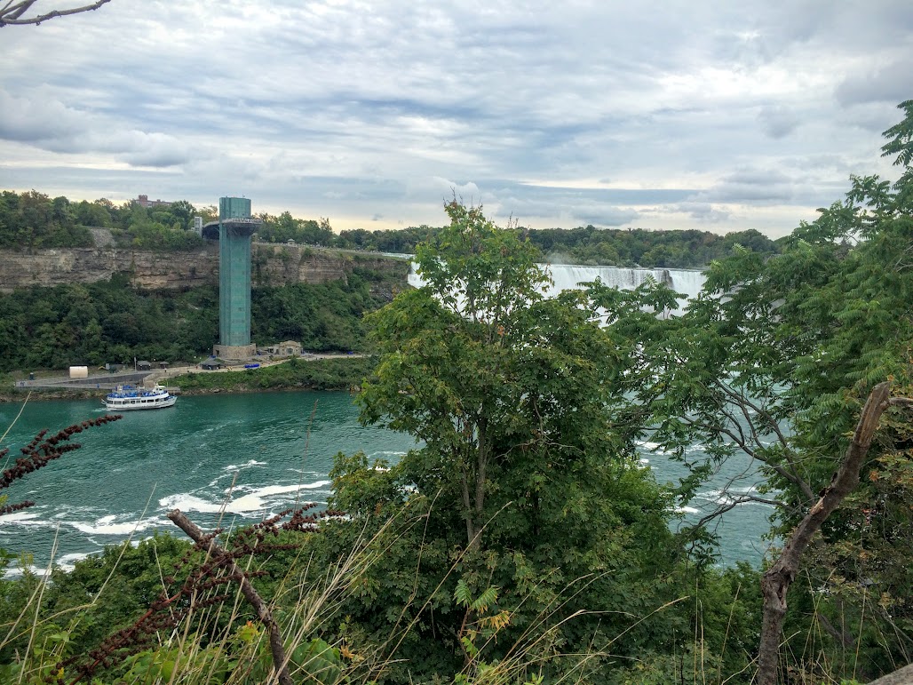 Walking down to the Hornblower Canadian falls boat tour. This is a pic of the American falls....obstructed by the trees! The tower on the other side is the elevator that takes you to the boat tour on the American side.