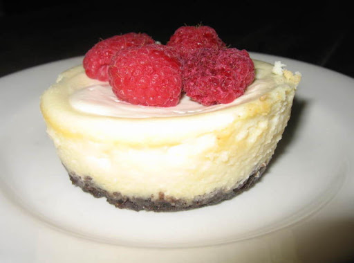 Beautiful mini cheesecakes with sour cream topping.  I add raspberries or blueberries over the finished product for extra pizazz!