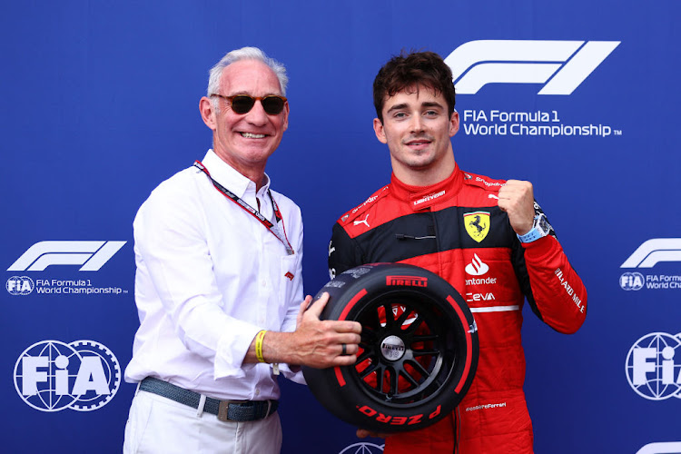 Pole position qualifier Charles Leclerc is presented with the Pirelli Pole Position trophy by Liberty CEO Greg Maffei during qualifying ahead of the F1 Grand Prix of Monaco at Circuit de Monaco on May 28, 2022 in Monte-Carlo, Monaco.