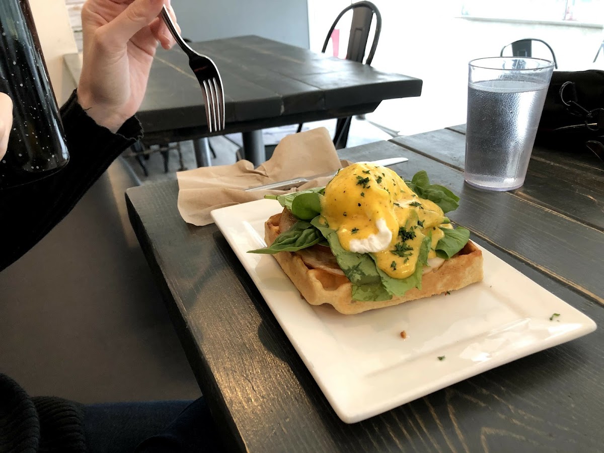 Small portion of egg Benedict on a waffle