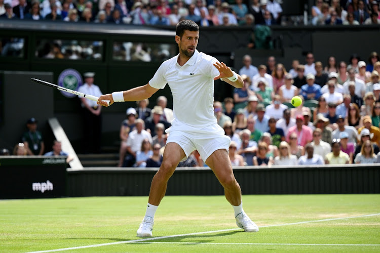 Novak Djokovic of Serbia plays a forehand against Hubert Hurkacz of Poland in their fourth round match of The Championships Wimbledon 2023 at the All England Lawn Tennis and Croquet Club on July 10 2023.