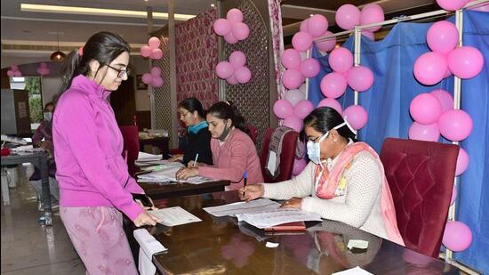 A woman casting her vote at a pink booth during the Punjab polls in Ludhiana on Sunday. (Gurpreet Singh/HT)