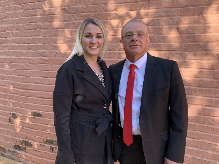 Nicoleen Swart and Gerrie Nel stand outside the Pretoria North magistrate's court.