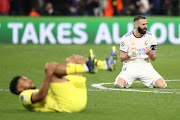 Karim Benzema of Real Madrid celebrates at full time after the Uefa Champions League quarterfinal second leg match against Chelsea at Estadio Santiago Bernabeu in Madrid on April 12 2022.