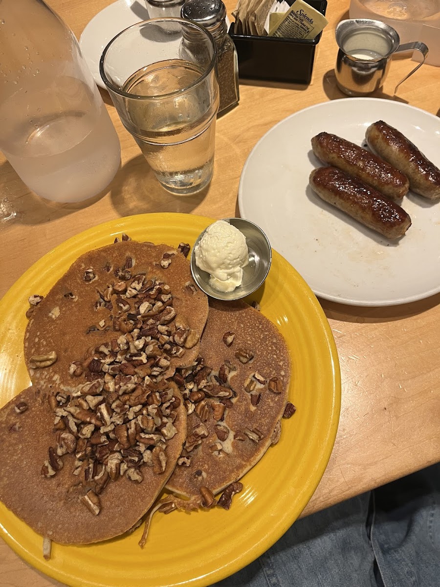 Gluten free pecan pancakes with tropical syrup and sausage links