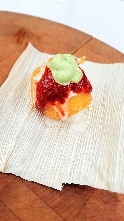 At the California Artisan Cheese Festival 2018 Best Bite Competition, Stephanie Foss of Whole Foods Market Sebastopol served Toma stuffed Arepas with Toma Cheese sauce, avocado crema, and homemade barbacoa sauce