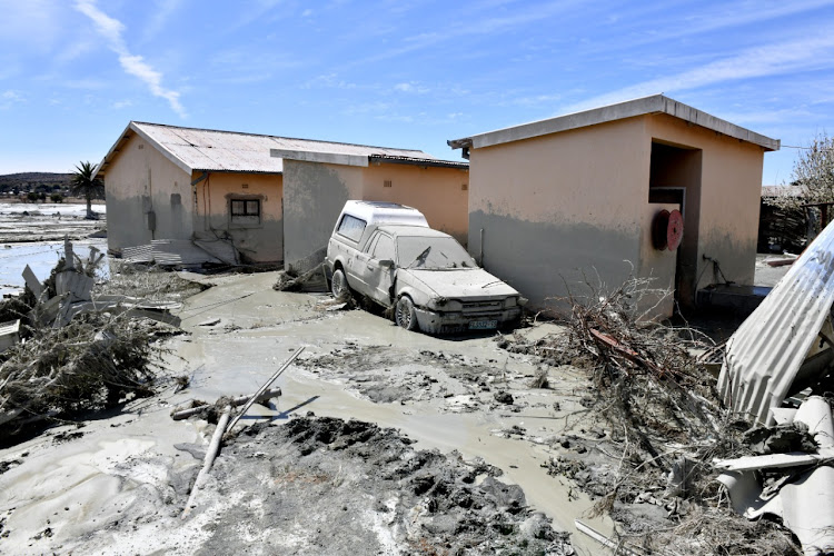 Homes, cars and other structures were devastated after the collapse of a tailings dam in Jagersfontein in September 2022. Picture: GCIS