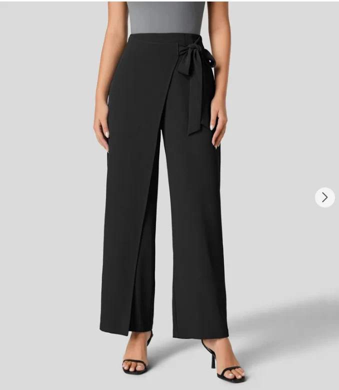 Kadın Yüksek Bel Bağcık Detaylı Geniş Paça Pantolon. Gizli Fermuar. Rahat ve şık bir görünüm için ideal seçim.