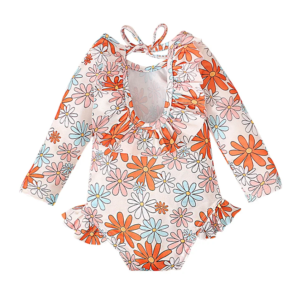 Maillot de bain fille à imprimé graphique, col rond et dos ouvert, parfait pour la plage et la piscine, offre confort et un look tendance.