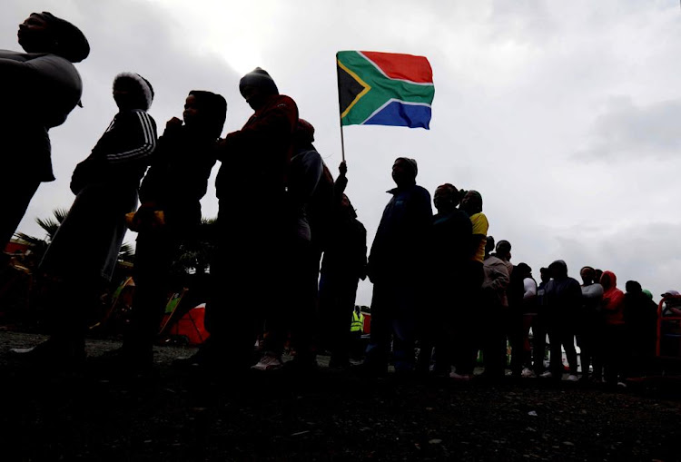 People queue to vote in Mitchells Plain, Cape Town.