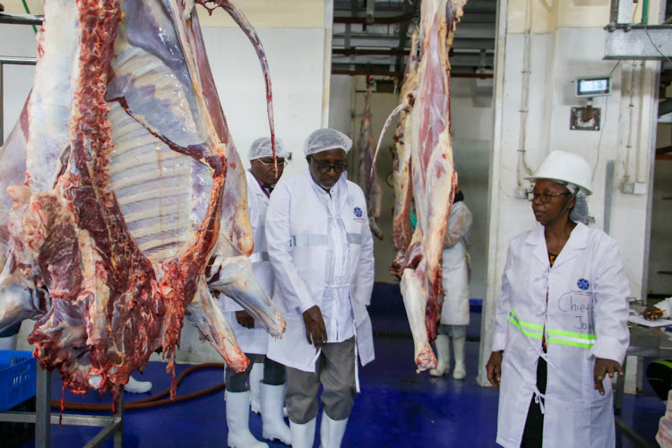 Agriculture CS Mithika Linturi and Joyce Gichuru, the chief grader in charge of production at Kenya Meat Commission in Kibarani