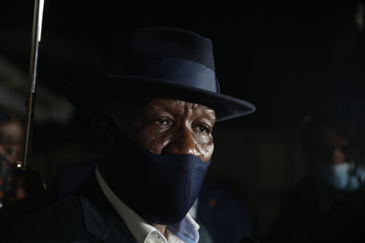 Police minister Bheki Cele speaks outside the Meyiwa house in Durban on Monday night.