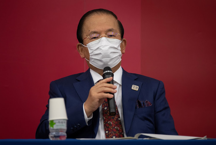 Tokyo 2020 Olympic Games CEO Toshiro Muto wears a face mask as he speaks during a news conference following a Tokyo 2020 Olympics Executive Board meeting in Tokyo, Japan December 22, 2020.