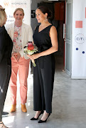 The Duchess of Sussex in a black Everlane jumpsuit.