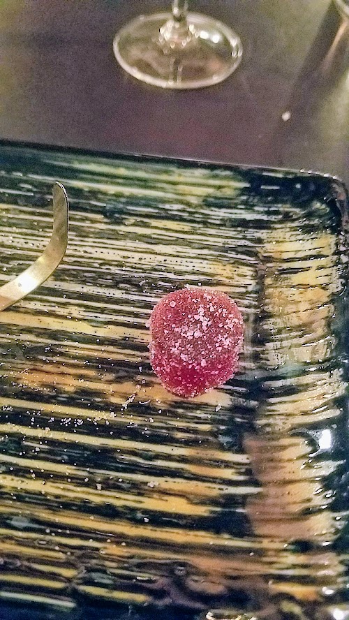 Holdfast Dining New Year's Eve Dinner, candies that included a toasted coconut shell bite, a cranberry pate de fruit that as sour like a sour patch kid, and a finish of a brown butter caramel with sea salt