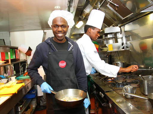 News anchor Larry Madowo prepares the Chicken Maisha dish