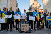 People participate in a flash mob protest against the Russian invasion of Ukraine, in Manhattan, New York City.