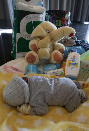 Baby Blessing at home after spending his first days at Frere Hospital after he was found . Picture: MICHAEL PINYANA