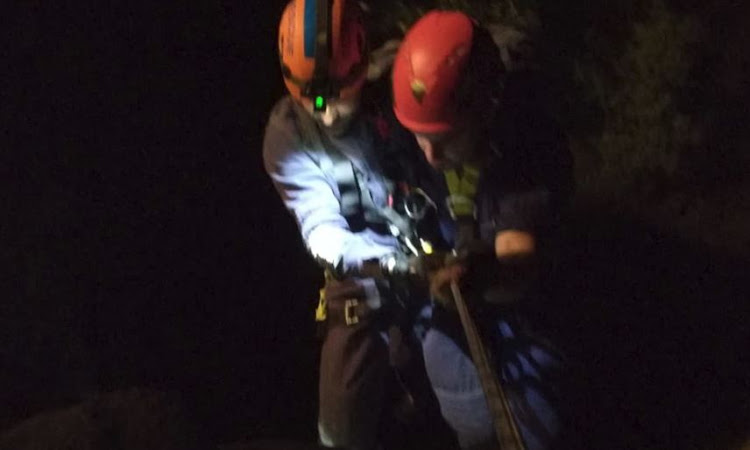 An image from a bold rescue operation to save a teenage girl who plunged from a cliff near Winston Park. She later died in hospital.