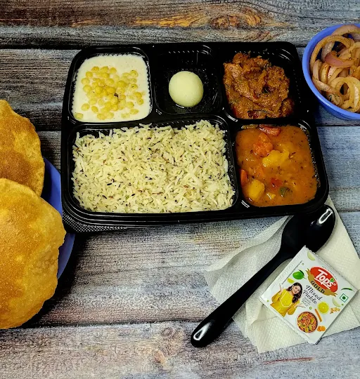 Aloo Tomato,Kashifal,Raita,Rasgulla,Poori(5pcs),Jira Rice,Pickle,Salad