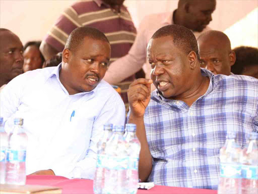 Interior CS Fred Matiang'i with Elgeyo Marakwet Governor Alex Tolgos at a security meeting in Tot, Kerio Valley, February 19, 2018. /STEPHEN RUTTO