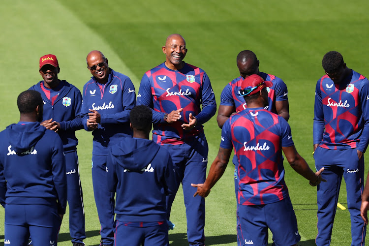 A file photo of West Indies head coach Phil Simmons with the players before the start of play against England at Old Trafford in Manchester in July 2020.