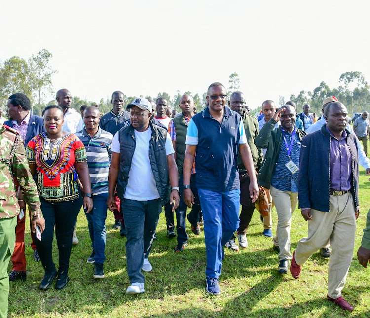 Uriri MP Mark Nyamita, ICT CS Eliud Owalo and other leaders during the commissioning of relief food distribution for the residents of Uriri constituency, Migori county on Saturday