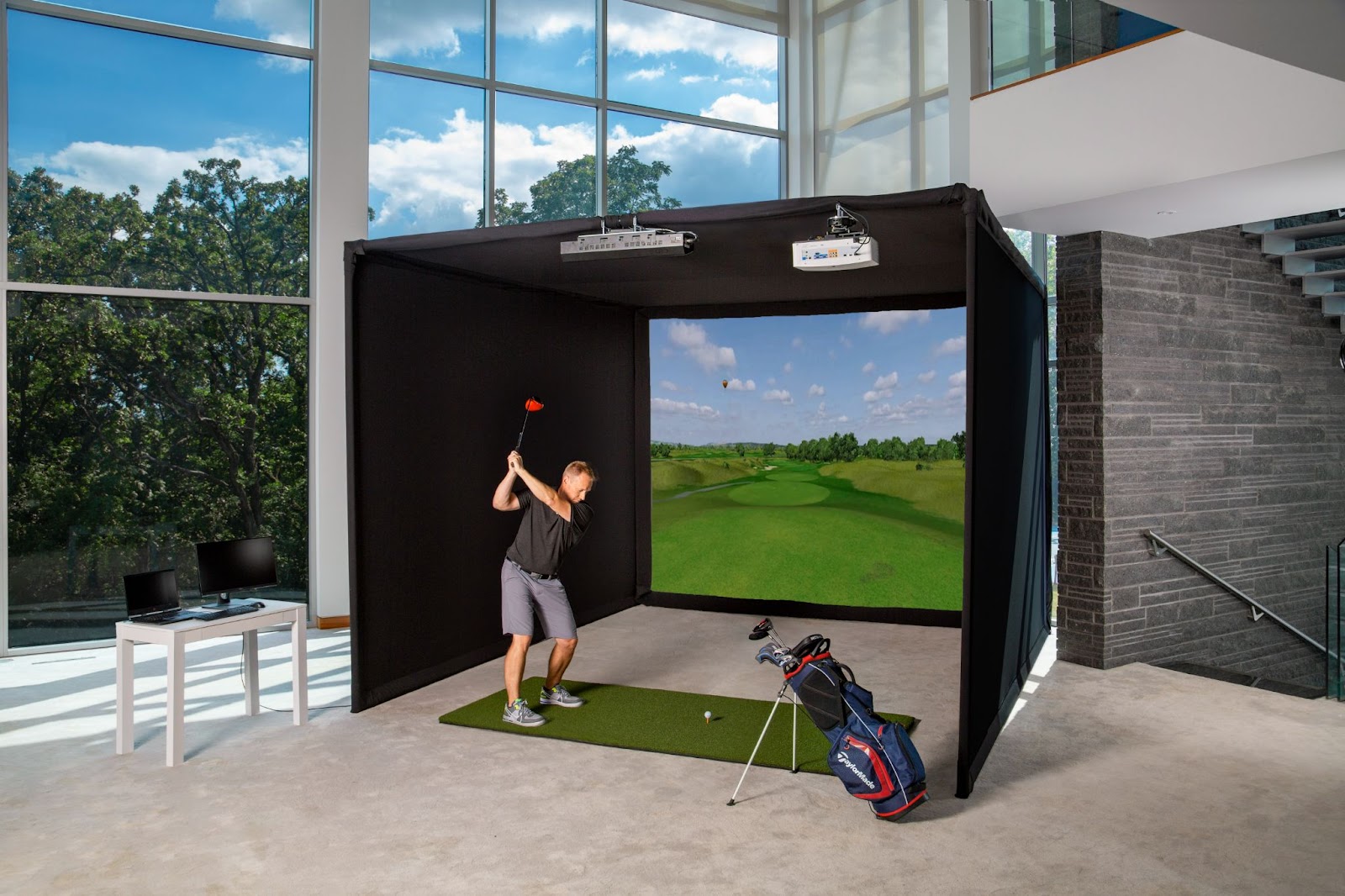 Carl's Place Pro Golf Enclosure protecting windows