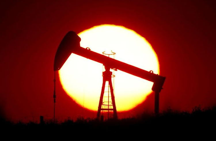 Oil gains as storm causes U.S. gulf production halts./REUTERS