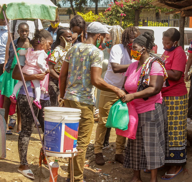 Life for Life youths surprise residents of Mathare Kambi Safi Car Wash with food donations